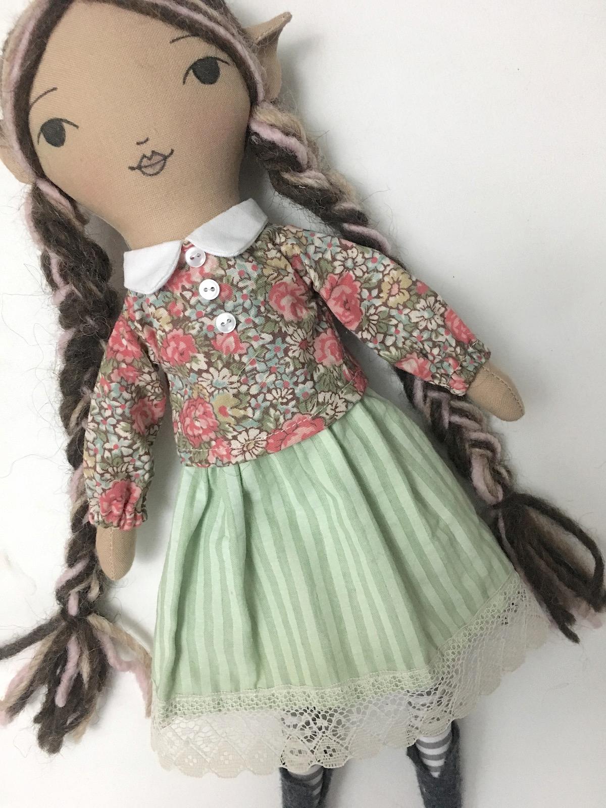 pixie doll wearing blouse skirt