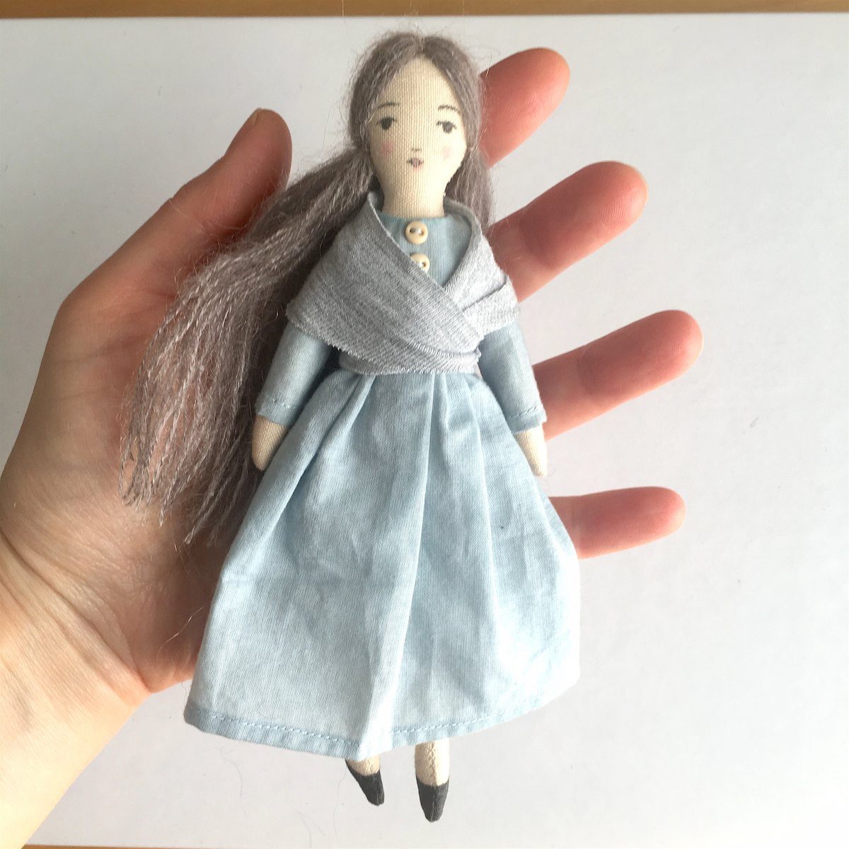 sew tiny doll that fits in the palm of your hand