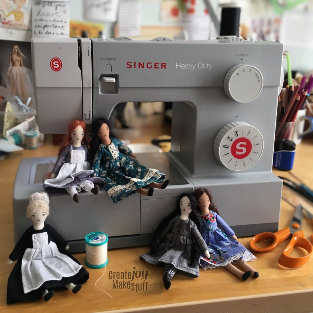 a variety of tiny cloth dolls to sew